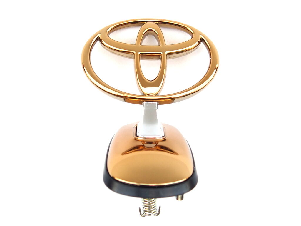 thumbnail image 2 of Genuine Toyota LandCruiser 60 Series Gold Bonnet Hood Badge Emblem – OEM 75303-90A01 2 of 2